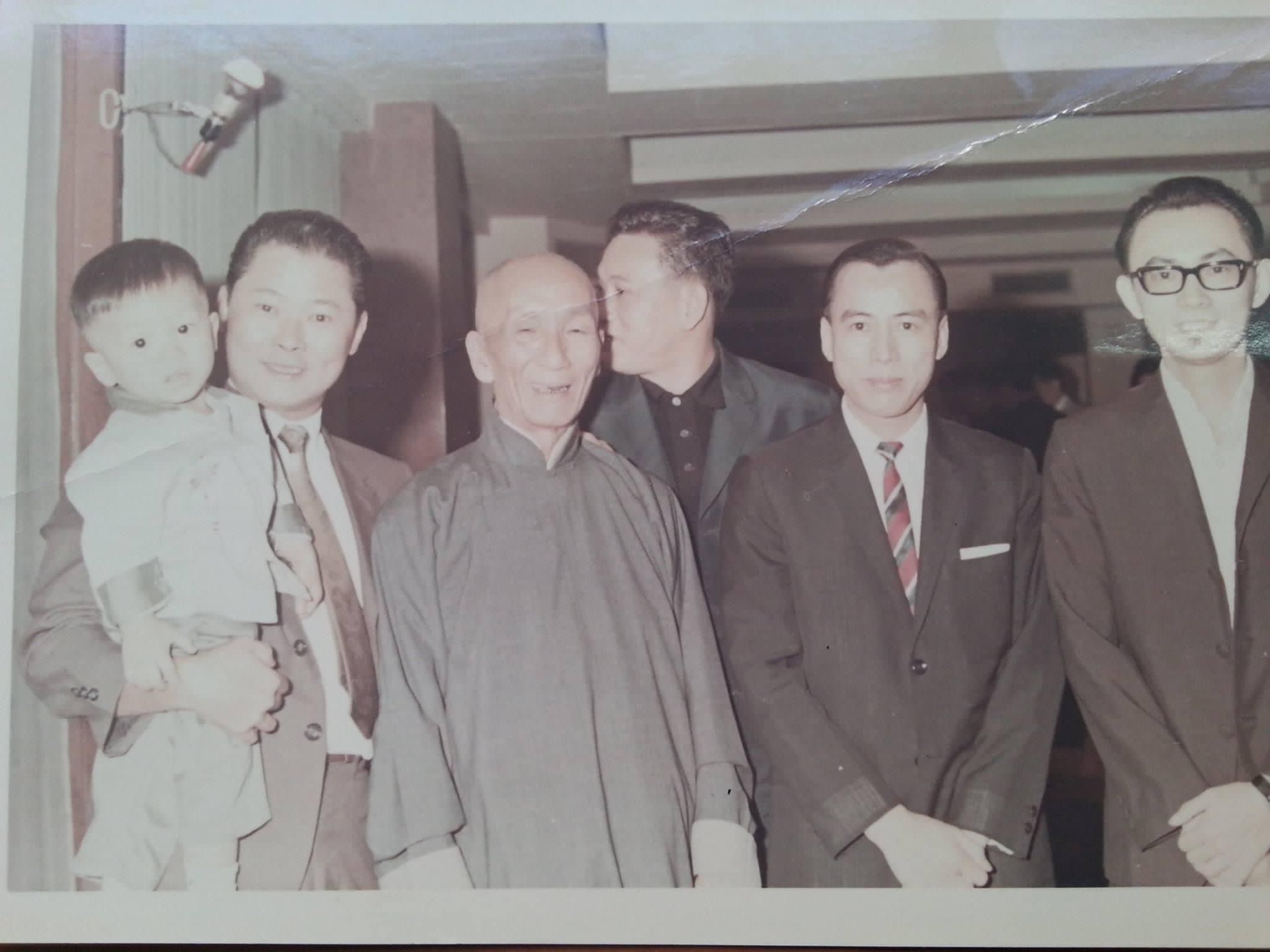 Archival group photograph with Sigung Ip Man at the front centre, Lee Wai Chi, and Grandmaster Roland Tong at the far right wearing glasses